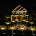 Decorative outdoor lights arranged in front of a house at night.